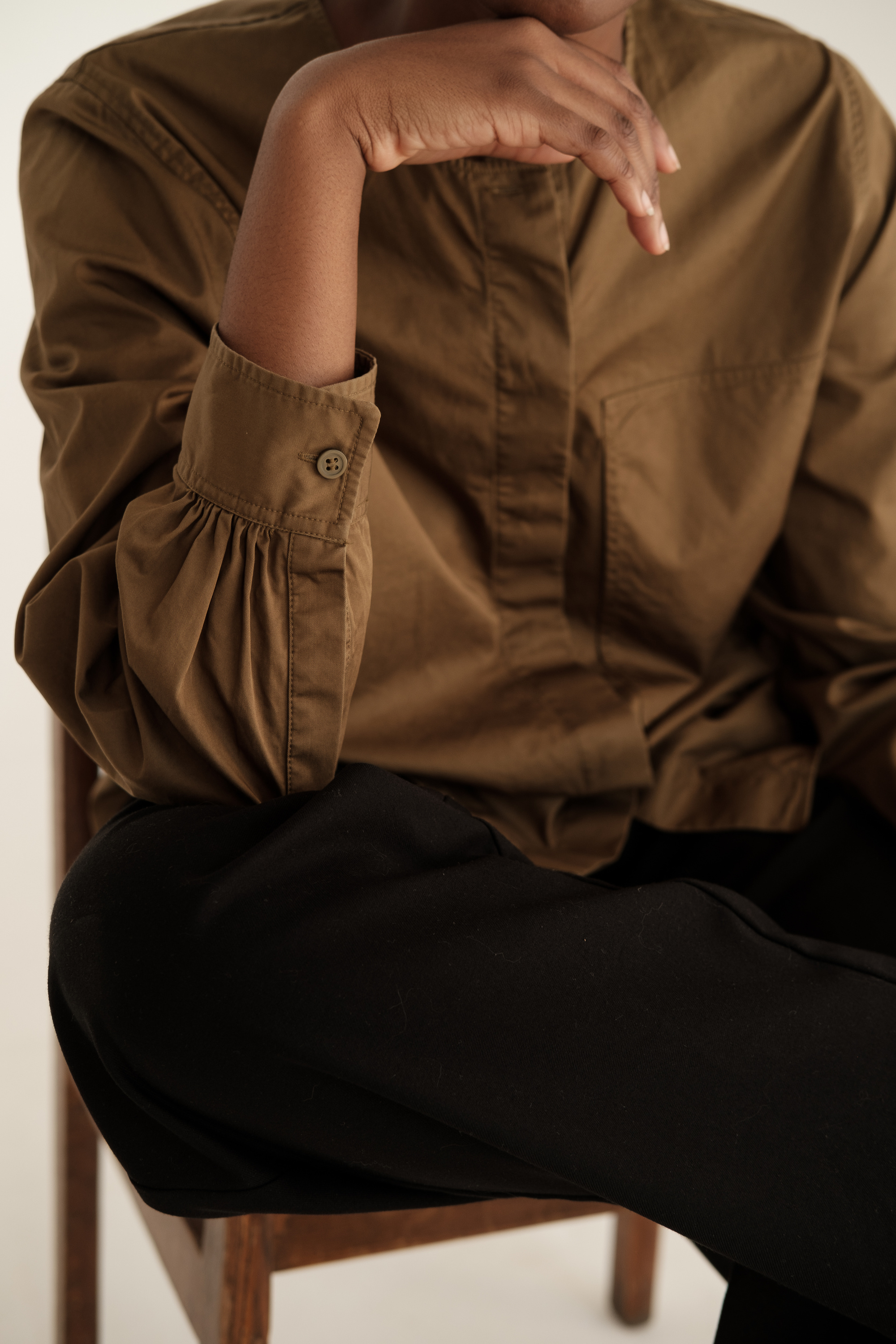 Woman in Casual Brown Dress Shirt and Slacks